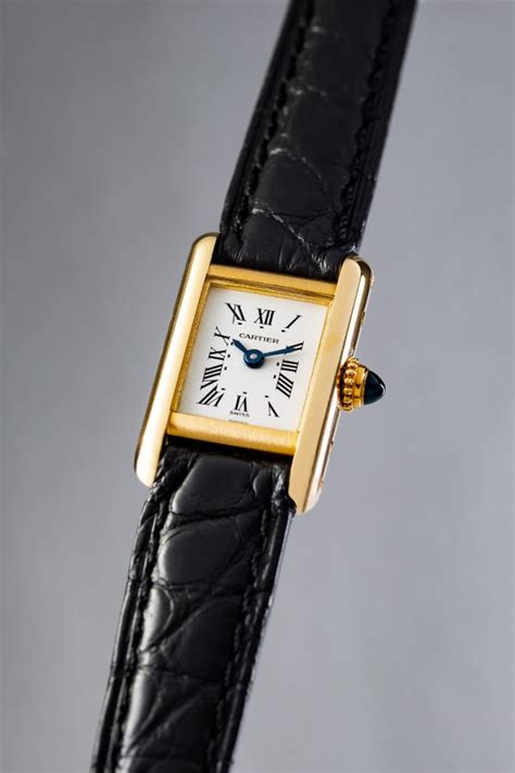 cartier mini tank watch.